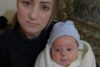 Die verwitwete Samia (Name geändert) mit ihrem drei Monate alten Sohn; John Eibner hat sie am 30.11. in Sadad besucht (csi)